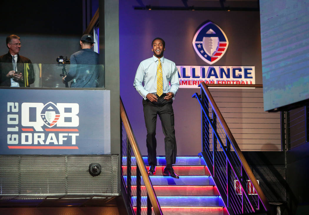 Josh Johnson walks down to the stage after becoming San Diego Fleet's first draft pick during the Alliance of America Football (AAF) Quarterback Draft at the Luxor in Las Vegas, Tuesday, Nov. 27, ...