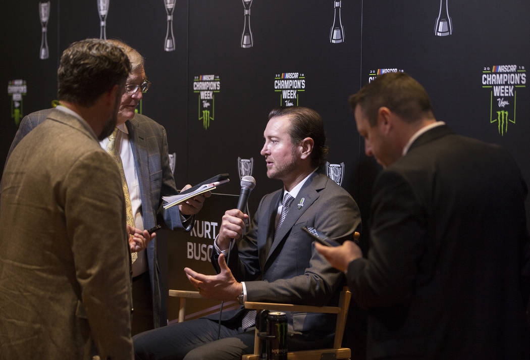 Driver Kurt Busch, middle, speaks with the media after the NASCAR NMPA Myers Brothers Awards at Encore Theater on Wednesday, Nov. 28, 2018, at Wynn Las Vegas, in Las Vegas. Benjamin Hager Las Vega ...