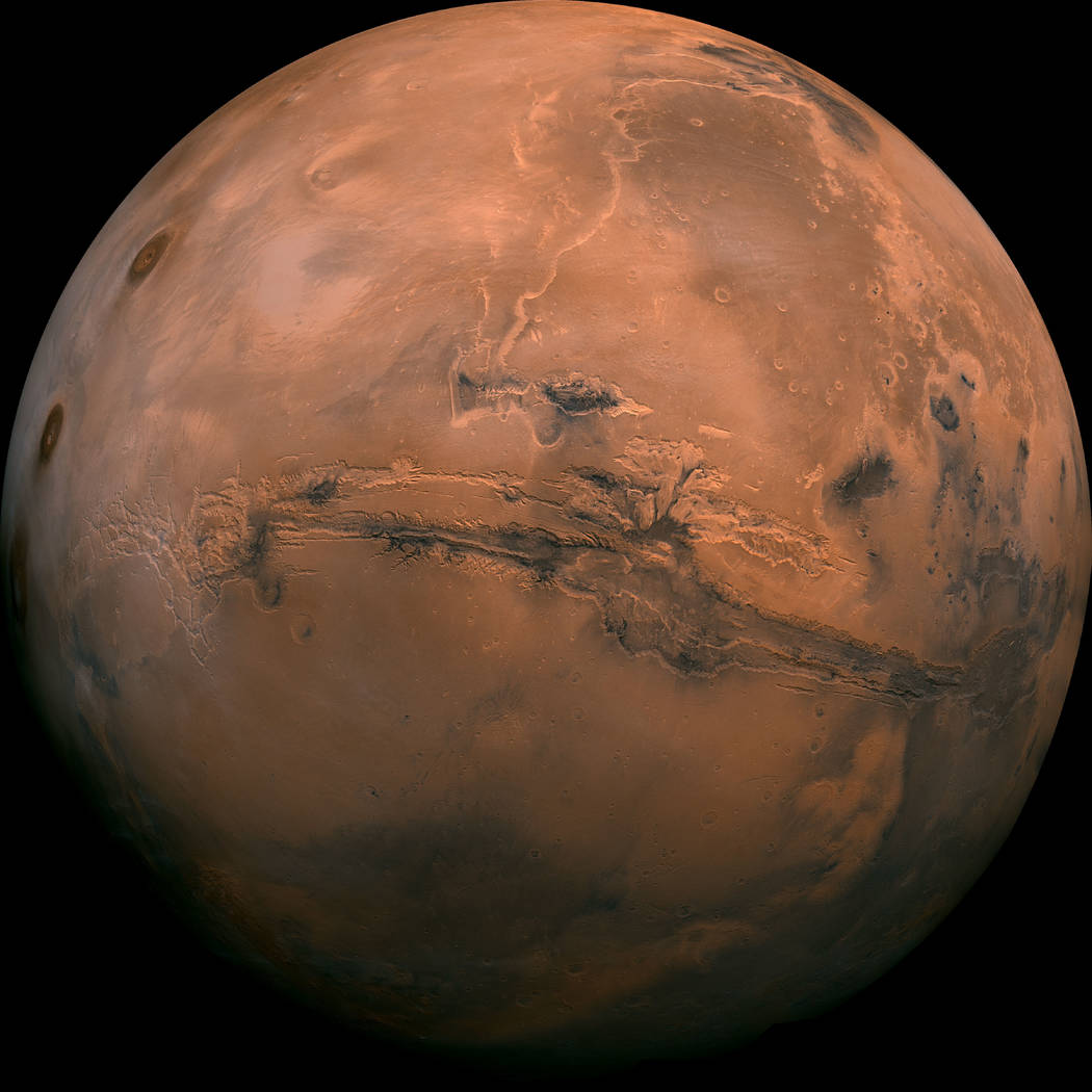 This image made available by NASA shows the planet Mars. This composite photo was created from over 100 images of Mars taken by Viking Orbiters in the 1970s. In our solar system family, Mars is Ea ...