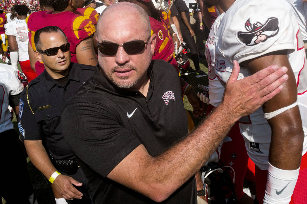 UNLV Rebels head coach Tony Sanchez leaves the field following after losing to the USC Trojans in a football game at the Los Angeles Memorial Coliseum in Los Angeles on Saturday, Sept. 1, 2018. U ...