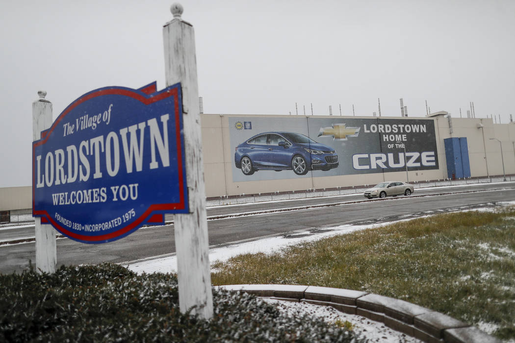 A banner depicting the Chevrolet Cruze model vehicle is displayed at the General Motors' Lordstown plant, Tuesday, Nov. 27, 2018, in Lordstown, Ohio. Even though unemployment is low, the economy i ...