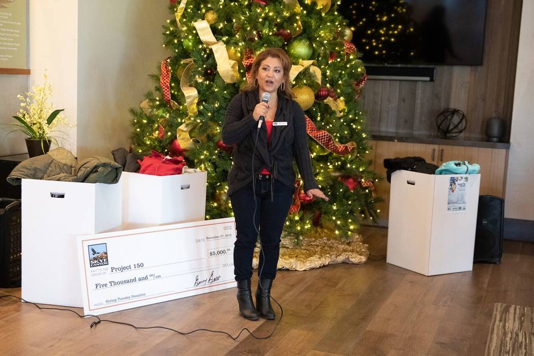 Meli Pulido, Project 150’s executive director, accepted the gifts on behalf of the nonprofit. (Skye Canyon)