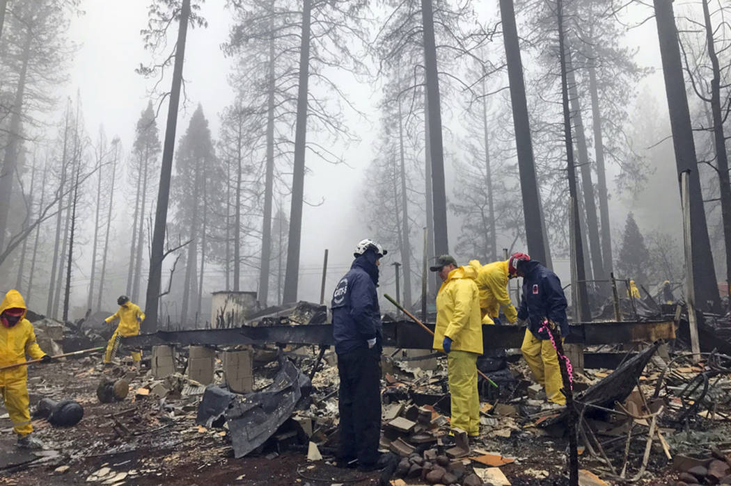 Volunteers resume their search for human remains at a mobile home park in Paradise, Calif., on Nov. 23, 2018. (AP Photo/Kathleen Ronayne, File)