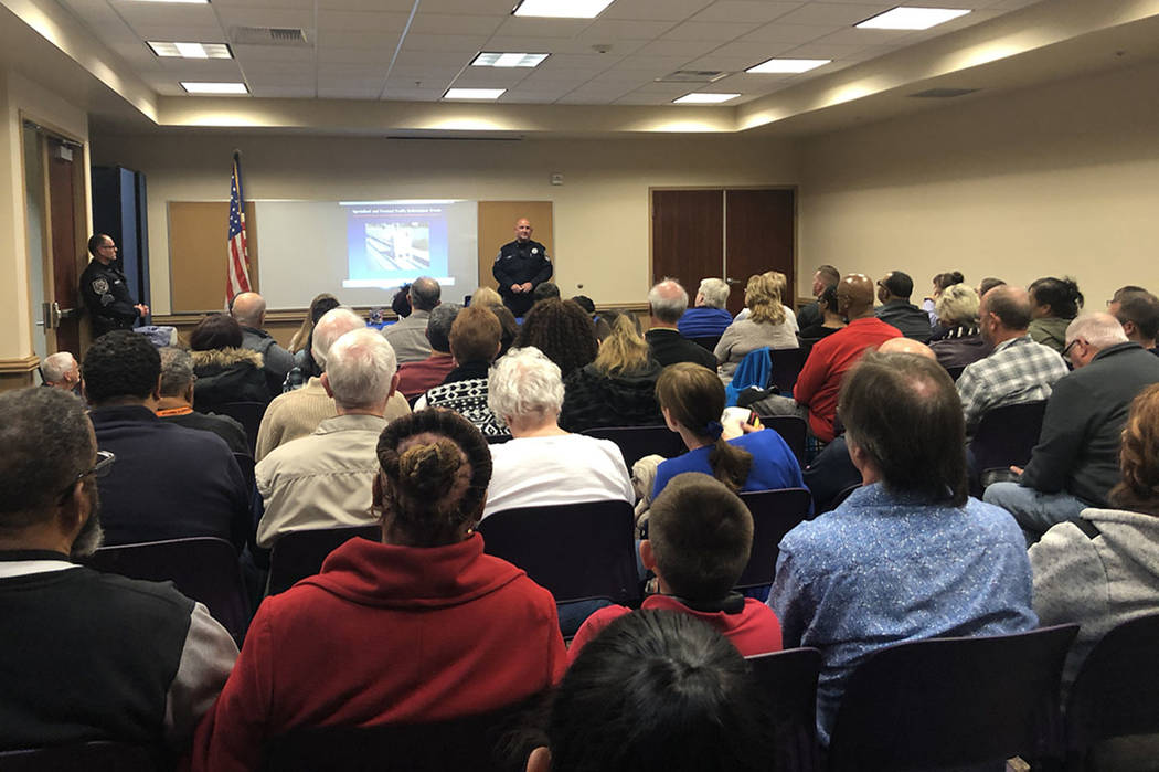 A North Las Vegas Police Department traffic officer addresses a crowd of nearly 100 North Las Vegas residents at a community meeting on Wednesday, Nov. 28, 2018. Though the meeting was scheduled t ...