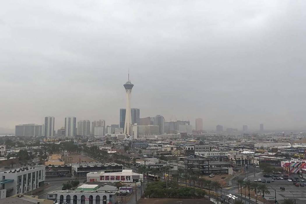 Clouds hang over downtown Las Vegas, Nov. 29, 2018. Light showers should fall across the Las Vegas Valley through tonight. (John Katsilometes/Las Vegas Review-Journal)