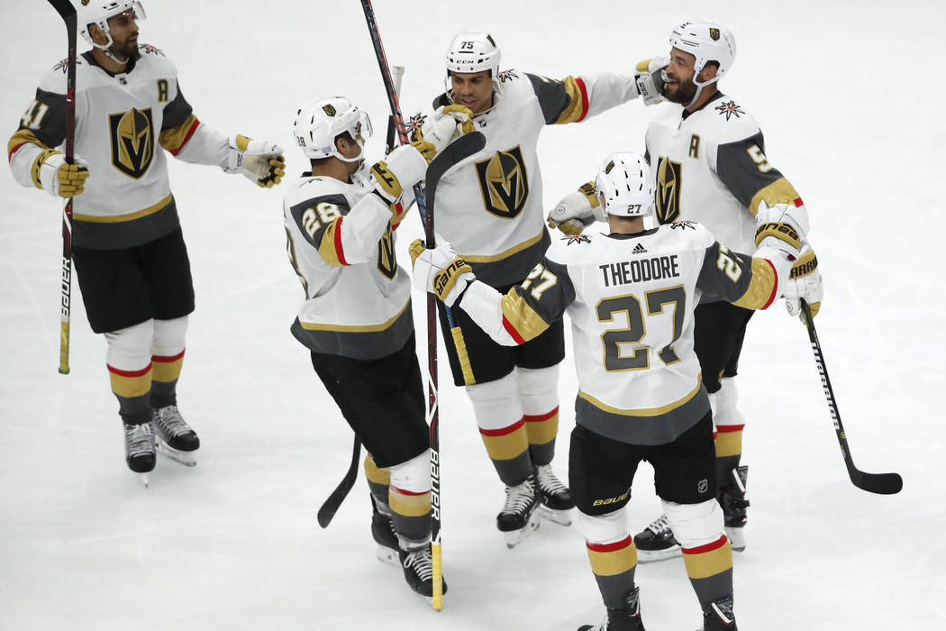 Vegas Golden Knights defenseman Deryk Engelland (5) celebrates his goal against the Chicago Blackhawks with his line mates during the second period of an NHL hockey game Tuesday, Nov. 27, 2018, in ...
