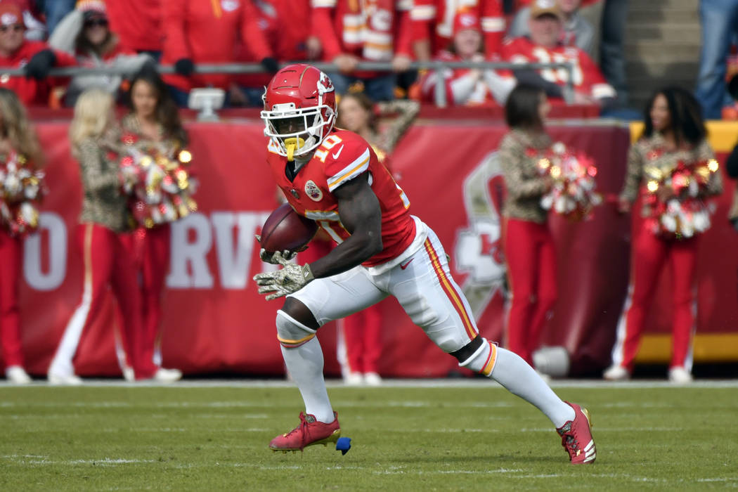 Kansas City Chiefs wide receiver Tyreek Hill (10) carries a punt return during the first half of an NFL football game against the Arizona Cardinals in Kansas City, Mo., Sunday, Nov. 11, 2018. (AP ...