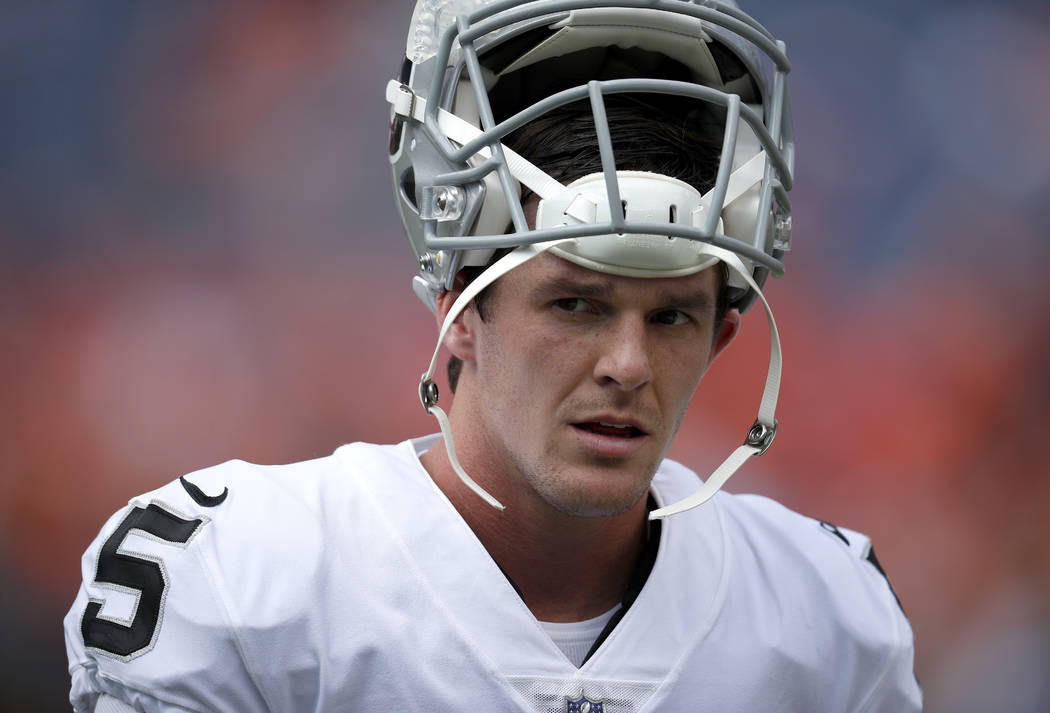 Oakland Raiders punter Johnny Townsend (5) walks to the bench prior to an NFL football game against the Denver Broncos, Sunday, Sept. 16, 2018, in Denver. (AP Photo/David Zalubowski)
