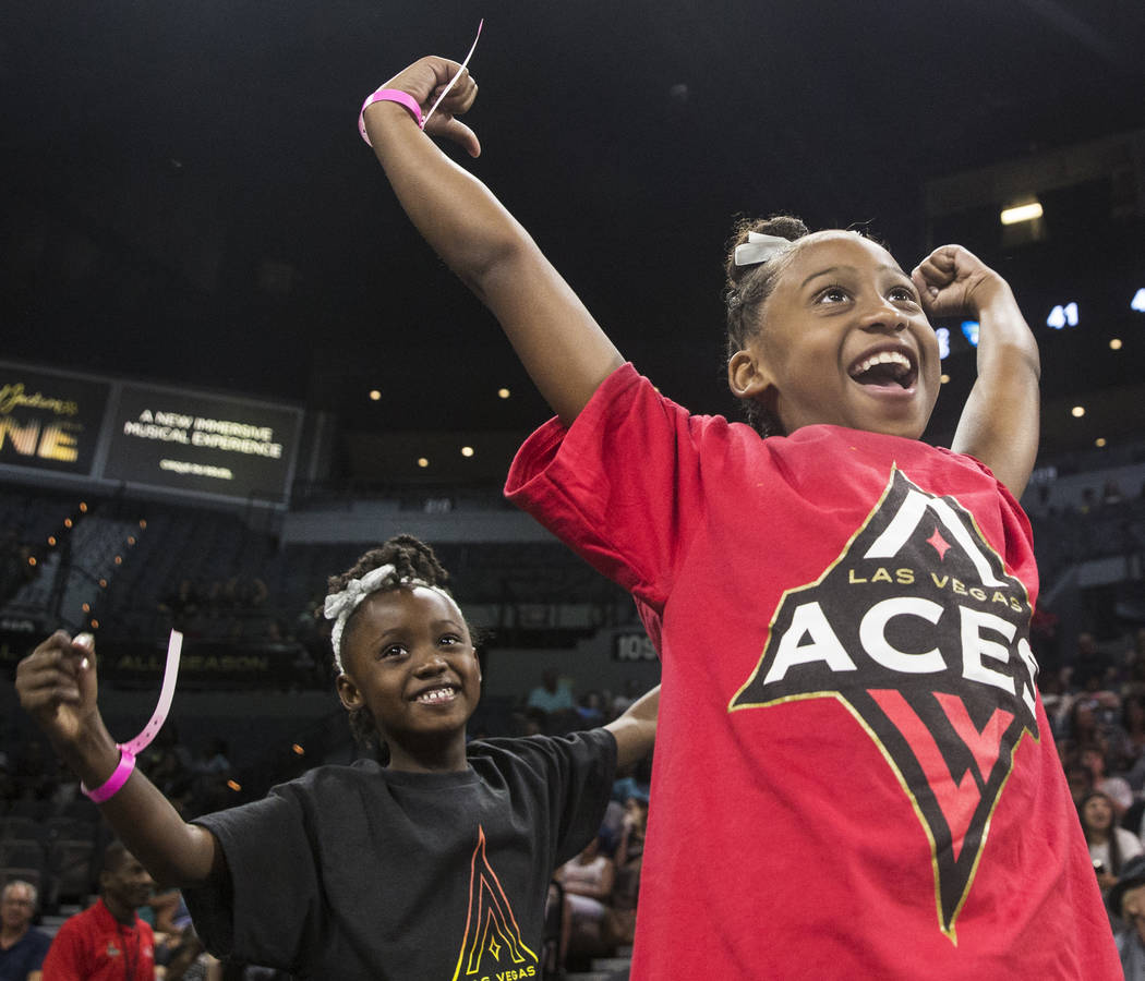 Aces fans Eva Jordan, right, and Morgan Brown cheer for Las Vegas in the 1st quarter during their matchup with the Dallas Wings on Wednesday, June 27, 2018, at the Mandalay Bay Events Center, in L ...