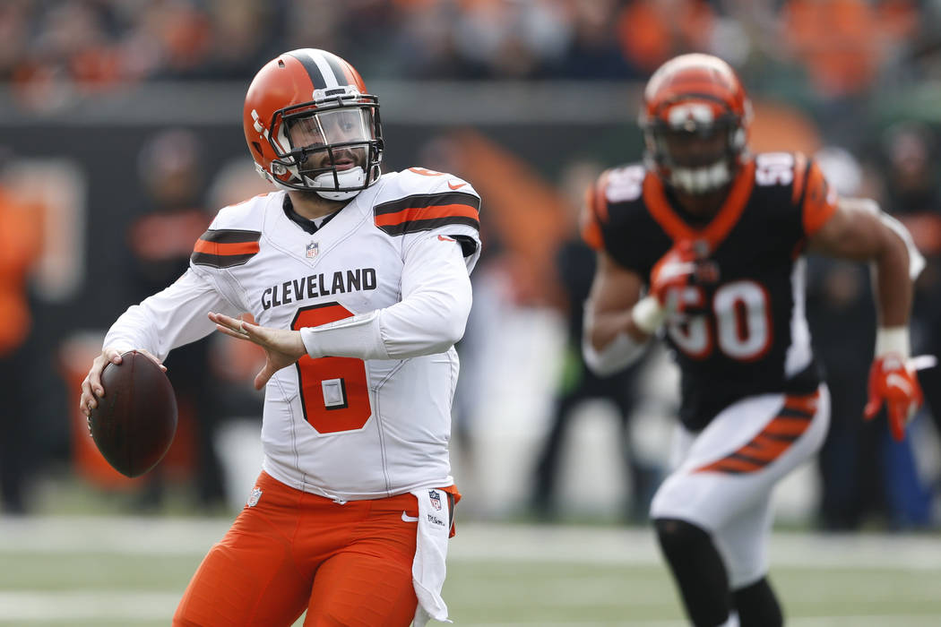 Cleveland Browns quarterback Baker Mayfield runs the ball in the first half of an NFL football game against the Cincinnati Bengals, Sunday, Nov. 25, 2018, in Cincinnati. (AP Photo/Gary Landers)