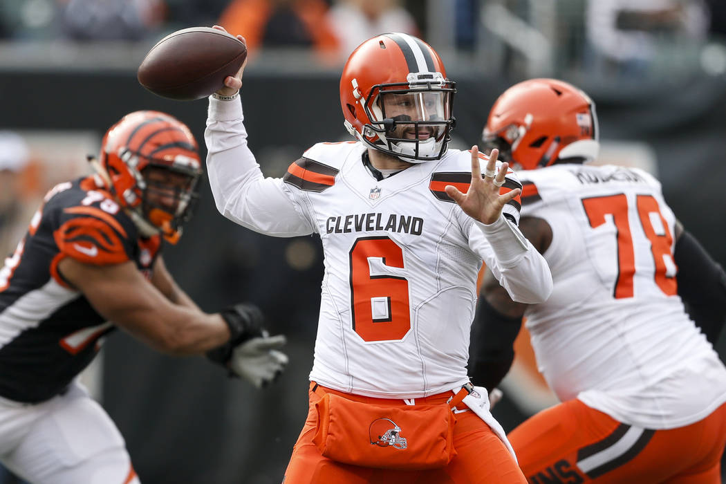 In this Nov. 25, 2018, file photo, Cleveland Browns quarterback Baker Mayfield passes in the first half of an NFL game against the Cincinnati Bengals, in Cincinnati. (AP Photo/Frank Victores, File)