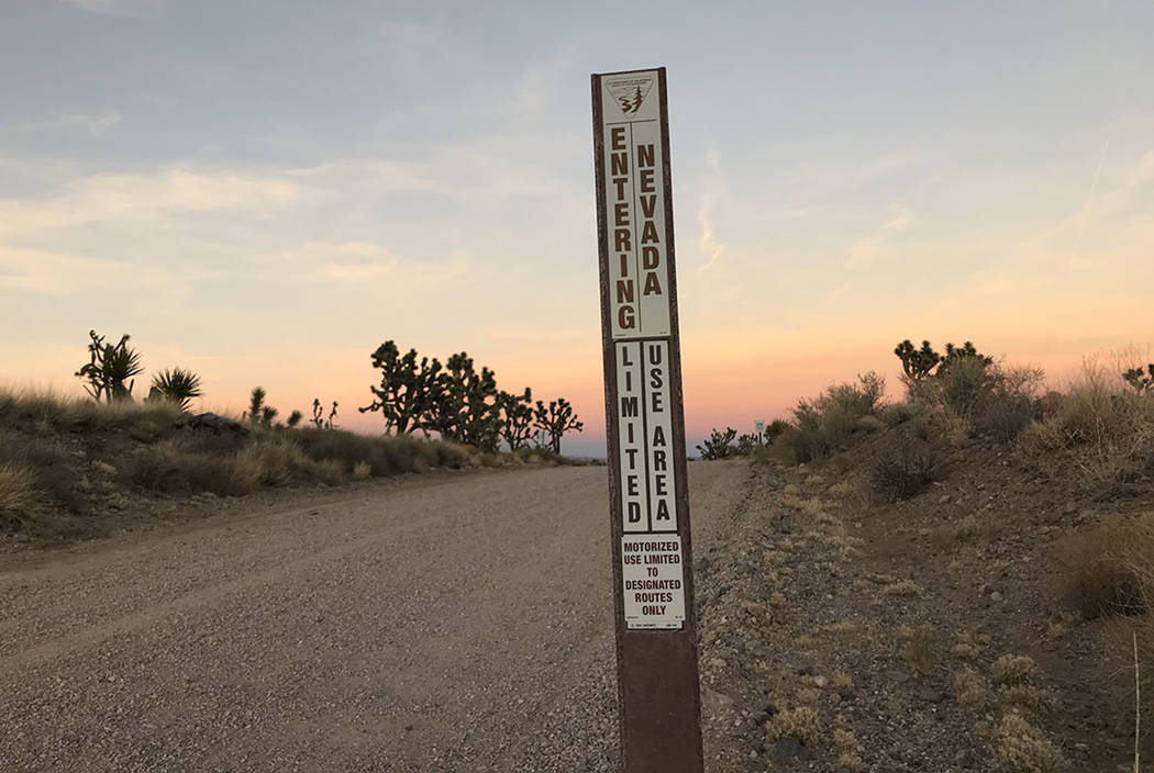 A sign marks the state line on a dirt road west of Searchlight on Nov. 25, 2017. A wind farm with as many as 220 40-story turbines has been proposed on the Nevada side of the line. Henry Brean Las ...