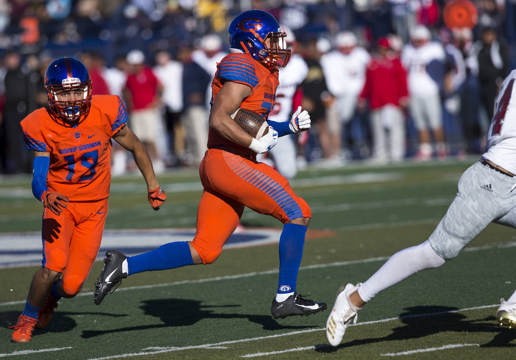Bishop Gorman running back Amod Cianelli (23), center, carries the ball for a touchdown against Liberty during the first half of the NIAA 4A Desert Region championship game at Bishop Gorman High S ...