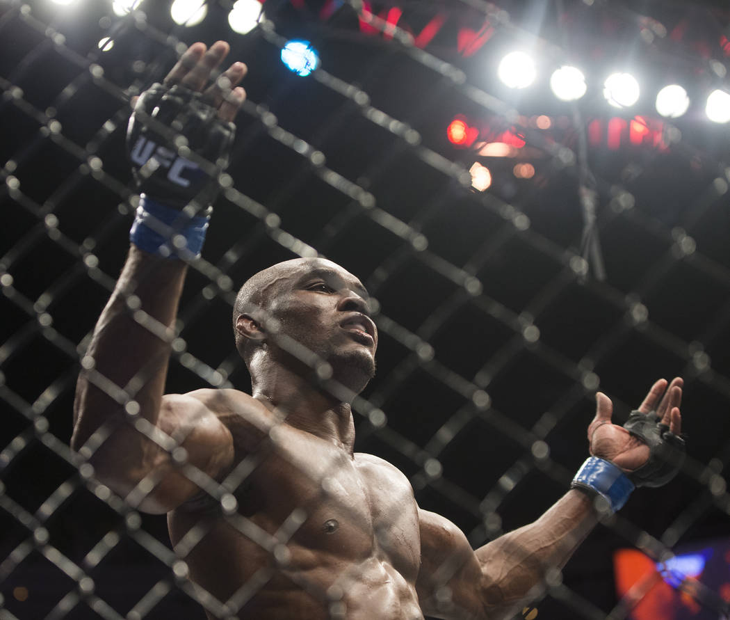 Kamaru Usman celebrates after defeating Rafael dos Anjos in a five round decision during "The Ultimate Fighter" Season 28 Finale on Friday, Nov. 30, 2018, at The Pearl, at Palms, in Las Vegas. Ben ...