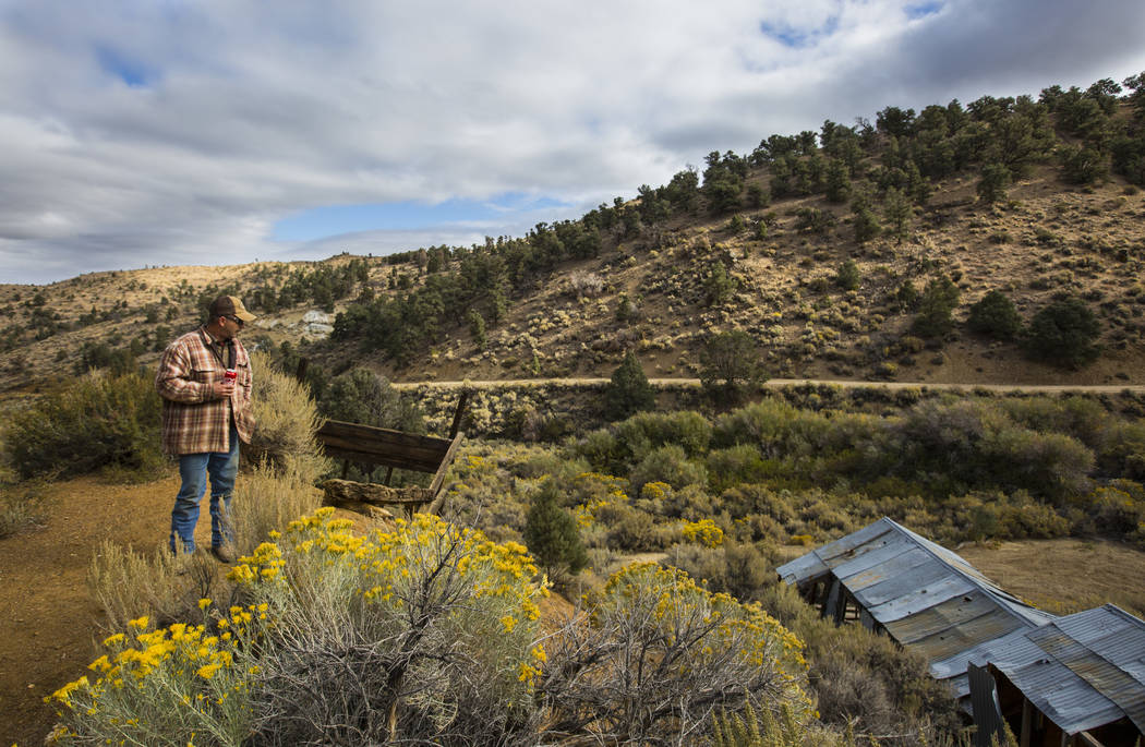 Caden Gould of Genoa walks around an area with old mines in search of vintage denim and other antiquities in south Douglas County on Thursday, Oct. 11, 2018. Mines in the area date as far back as ...