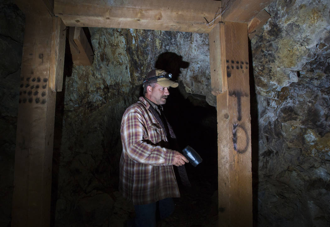Caden Gould of Genoa looks at the markings left in an old mine in search of vintage denim and other antiquities in south Douglas County on Thursday, Oct. 11, 2018. Mines in the area date as far ba ...