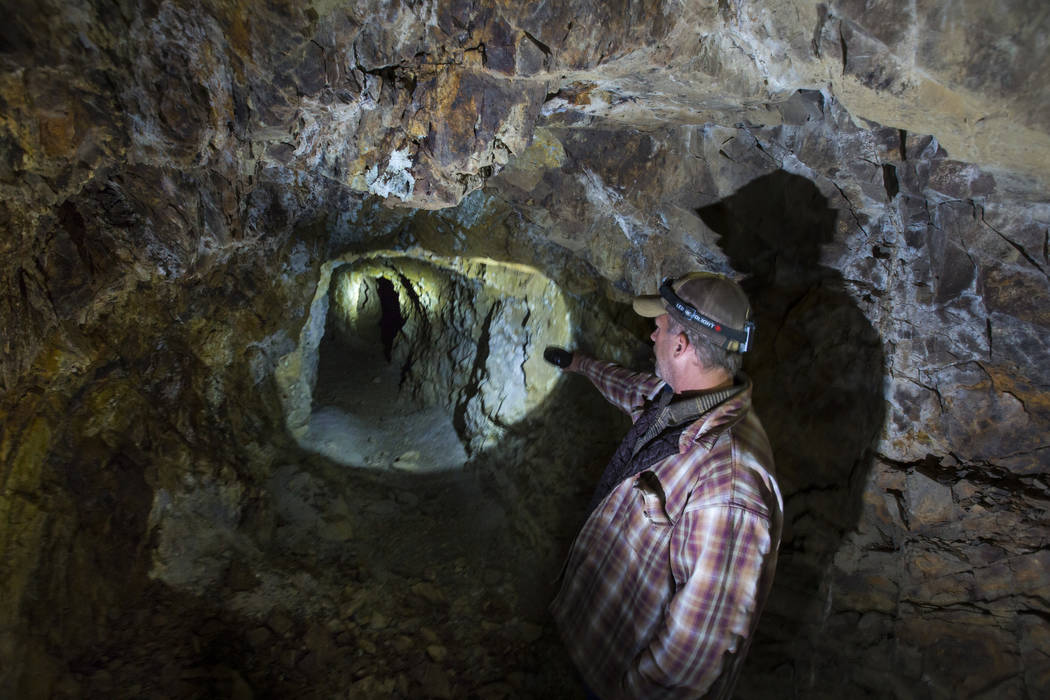 Caden Gould of Genoa searches through an old mine in search of vintage denim and other antiquities in south Douglas County on Thursday, Oct. 11, 2018. Mines in the area date as far back as the 186 ...