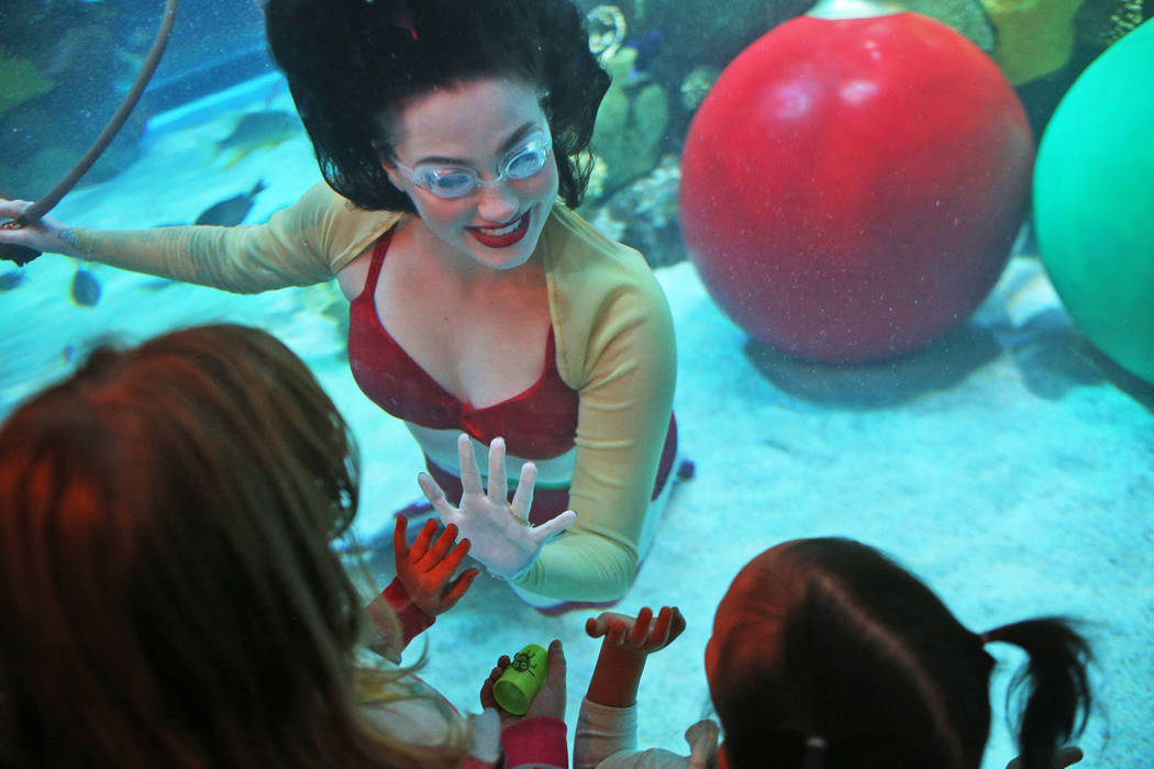 The Christmas mermaid greets children at Silverton hotel and casino in Las Vegas, Sunday, Dec. 2, 2018. She and Santa are in the aquarium every Saturday and Sunday in December from 12 p.m. to 1:15 ...
