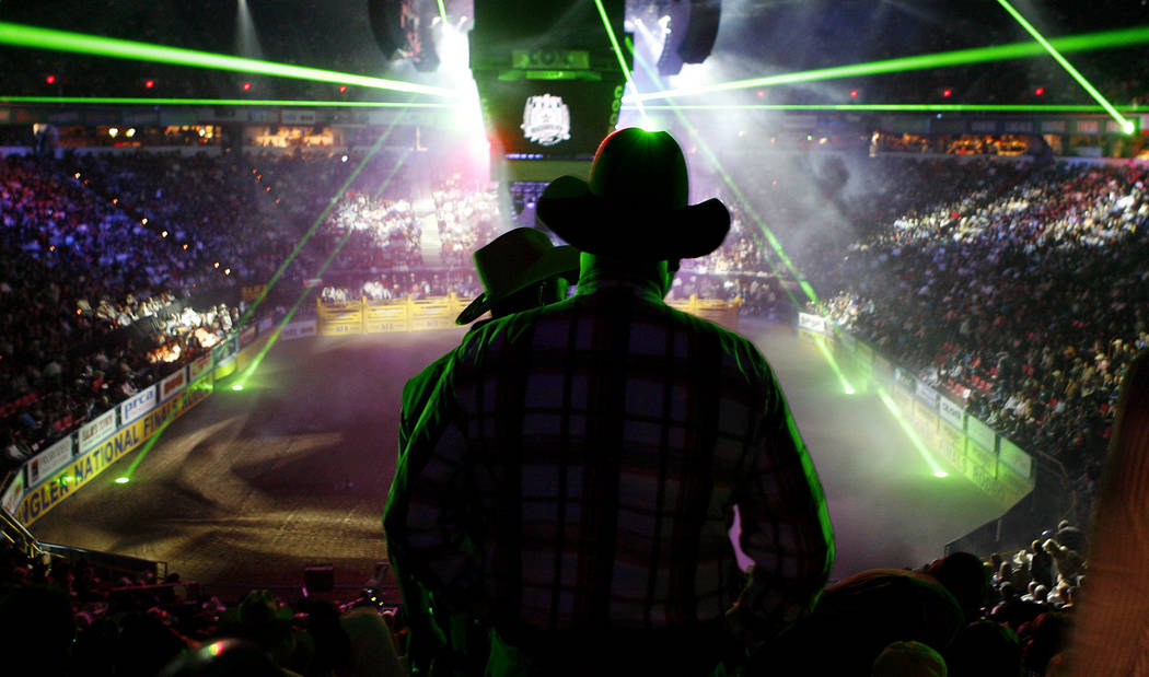 Cowboys file into the Thomas & Mack Center during the opening ceremonies of the fourth go-round of National Finals Rodeo at the Thomas & Mack Center in Las Vegas on Sunday, Dec. 9, 2007. (Issac Br ...