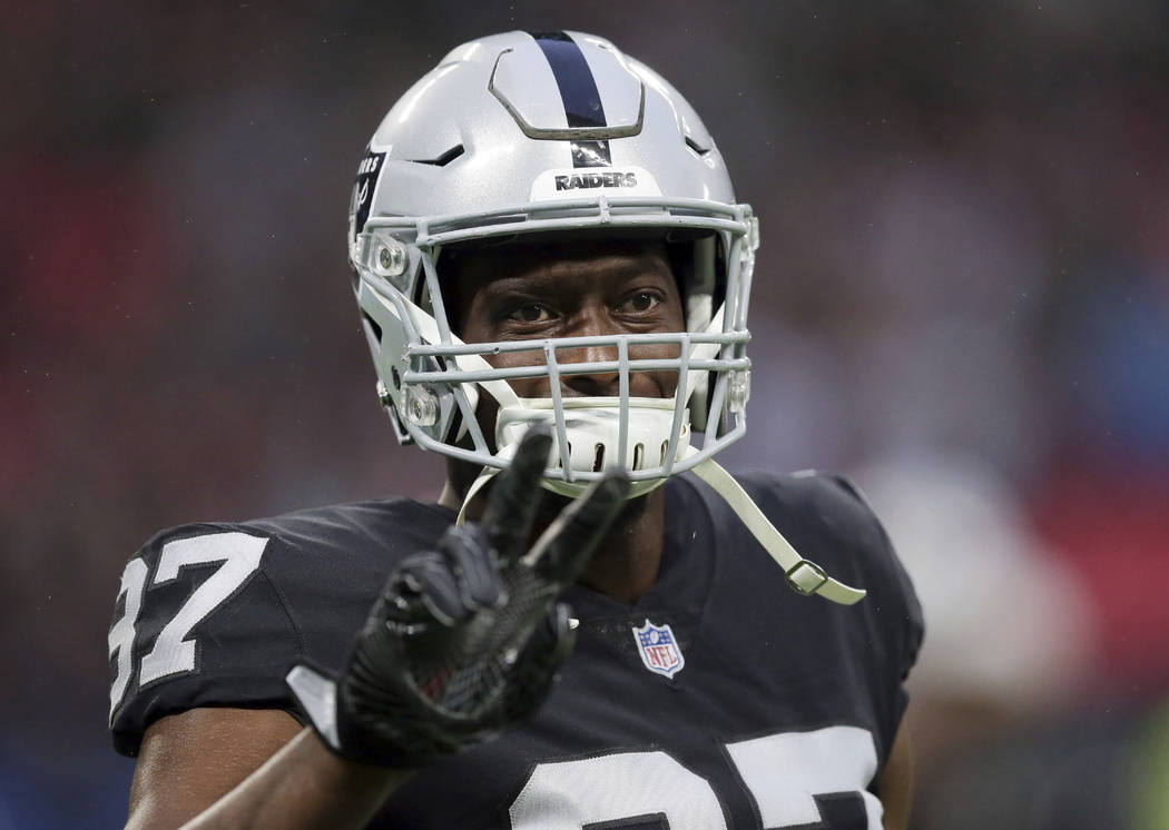 Oakland Raiders tight end Jared Cook (87) gestures during the warm-up before an NFL football game against Seattle Seahawks at Wembley stadium in London, Sunday, Oct. 14, 2018. (AP Photo/Tim Ireland)