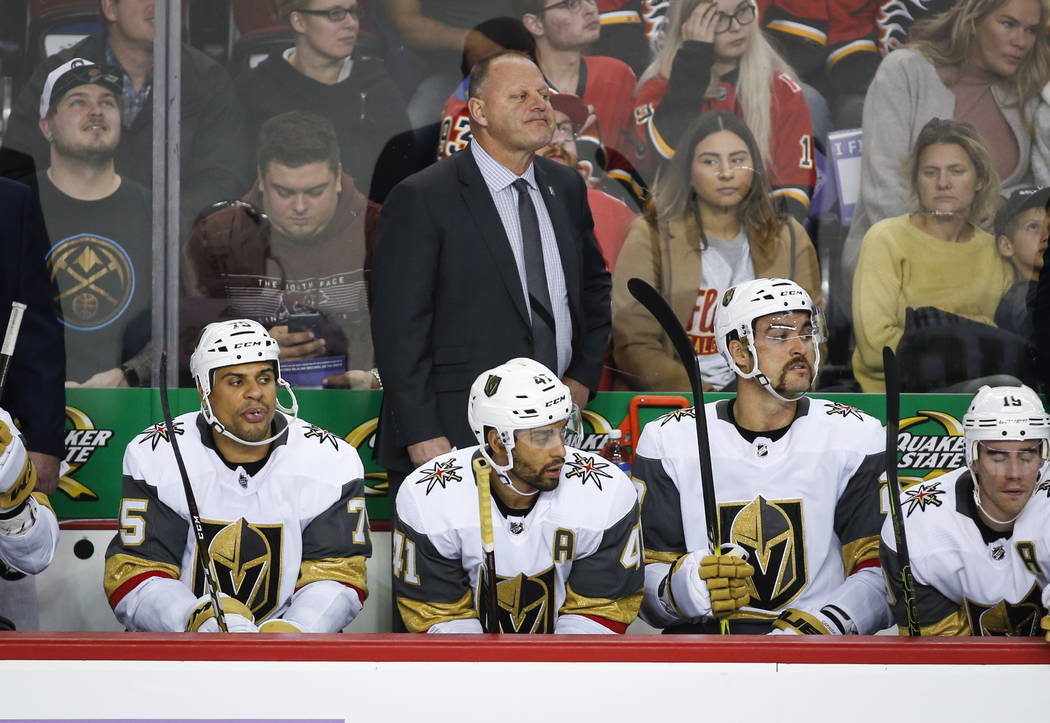 FILE - In this Nov. 19, 2018 file photo Vegas Golden Knights' head coach Gerard Gallant, top center, watches the action during second period NHL hockey game action against the Calgary Flames in Ca ...