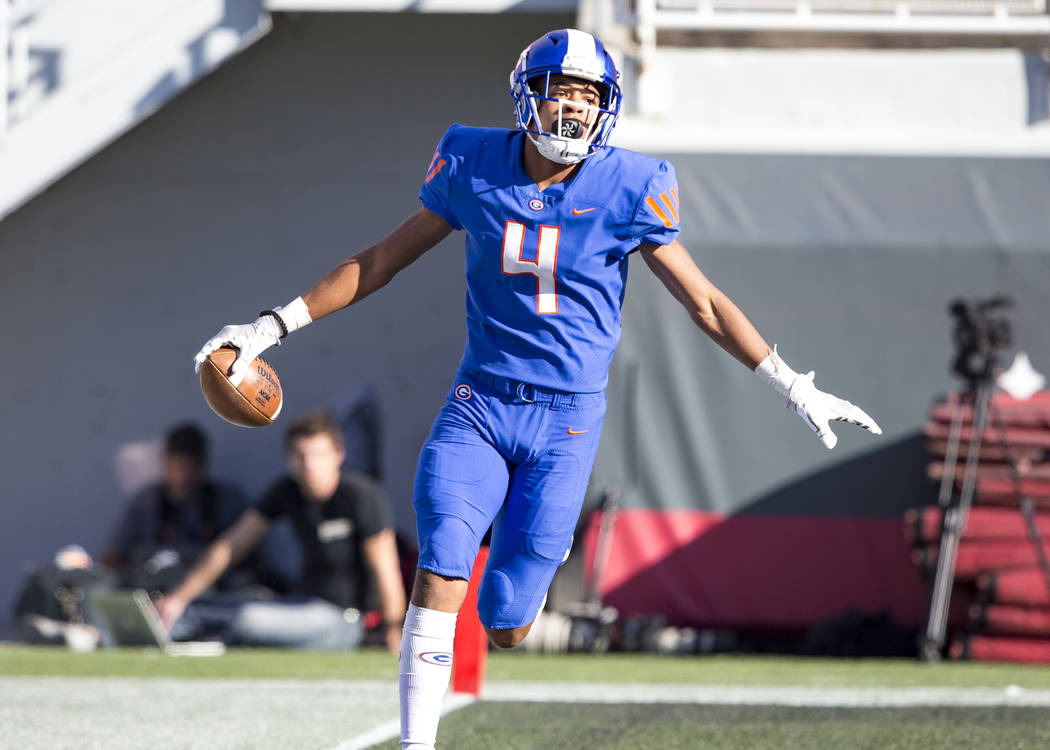 Bishop Gorman wide receiver Rome Odunze (4) reacts after scoring a touchdown against Reno's Bishop Manogue during the first half of the NIAA high school football championship at Sam Boyd Stadium i ...