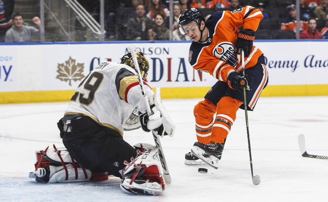 Vegas Golden Knights' goalie Marc-Andre Fleury (29) makes a save on Edmonton Oilers' Ty Rattie (8) during the second period of an NHL hockey game Saturday, Dec. 1, 2018, in Edmonton, Alberta. (Jas ...