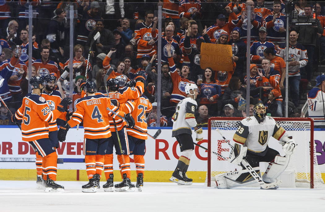 Edmonton Oilers celebrate a goal against the Vegas Golden Knights, as Golden Knights' Colin Miller (6) and goalie Marc-Andre Fleury (29) react during the third period of an NHL hockey game Saturda ...