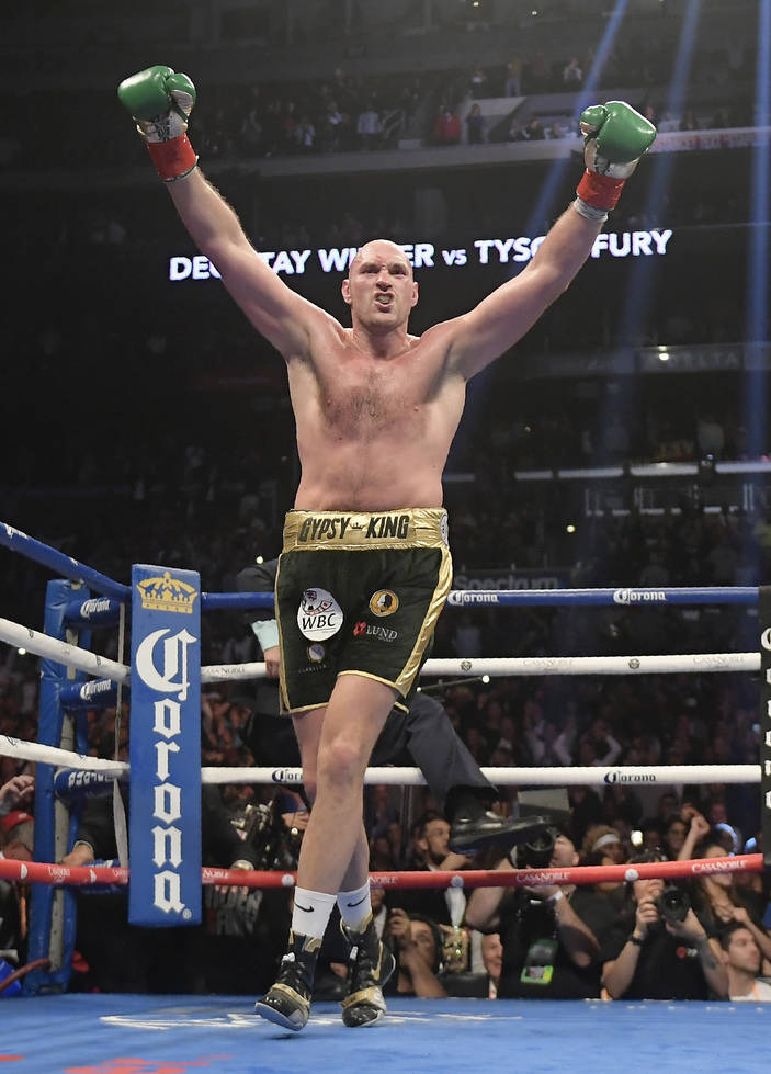 Tyson Fury, of England, celebrates as his WBC heavyweight championship boxing match against Deontay Wilder ends, Saturday, Dec. 1, 2018, in Los Angeles. The fight ended in a draw. (AP Photo/Mark J ...
