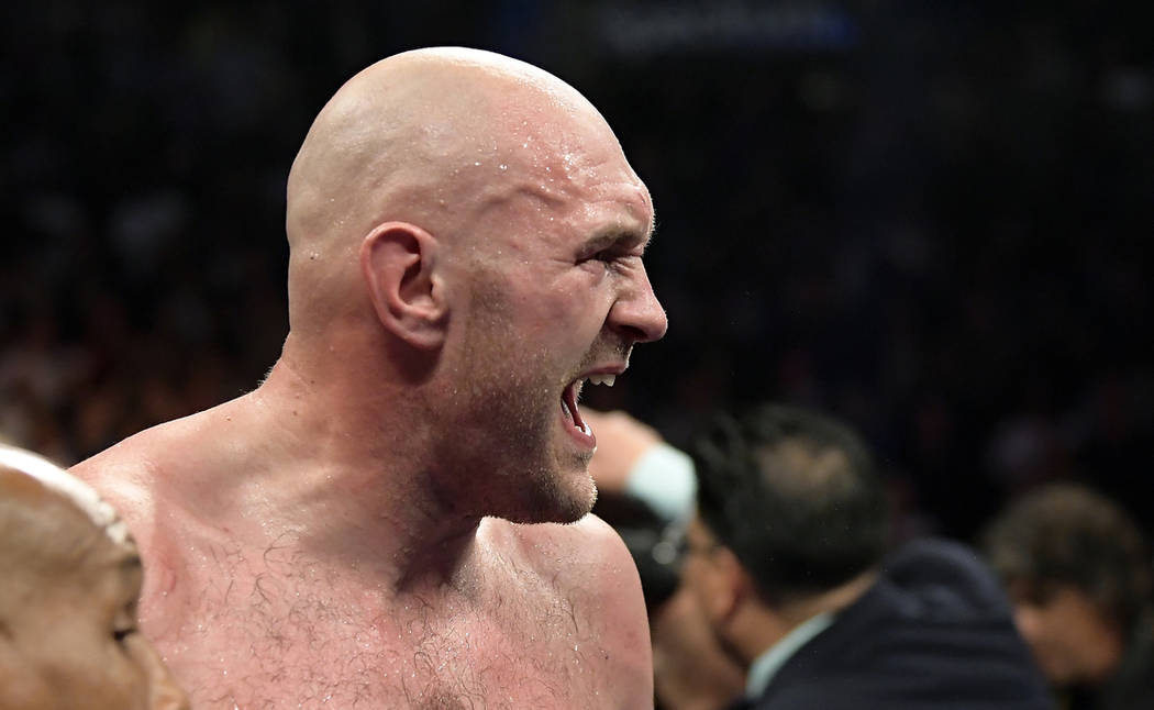 Tyson Fury, of England, yells after a WBC heavyweight championship boxing match against Deontay Wilder, Saturday, Dec. 1, 2018, in Los Angeles. The fight ended in a draw. (AP Photo/Mark J. Terrill)