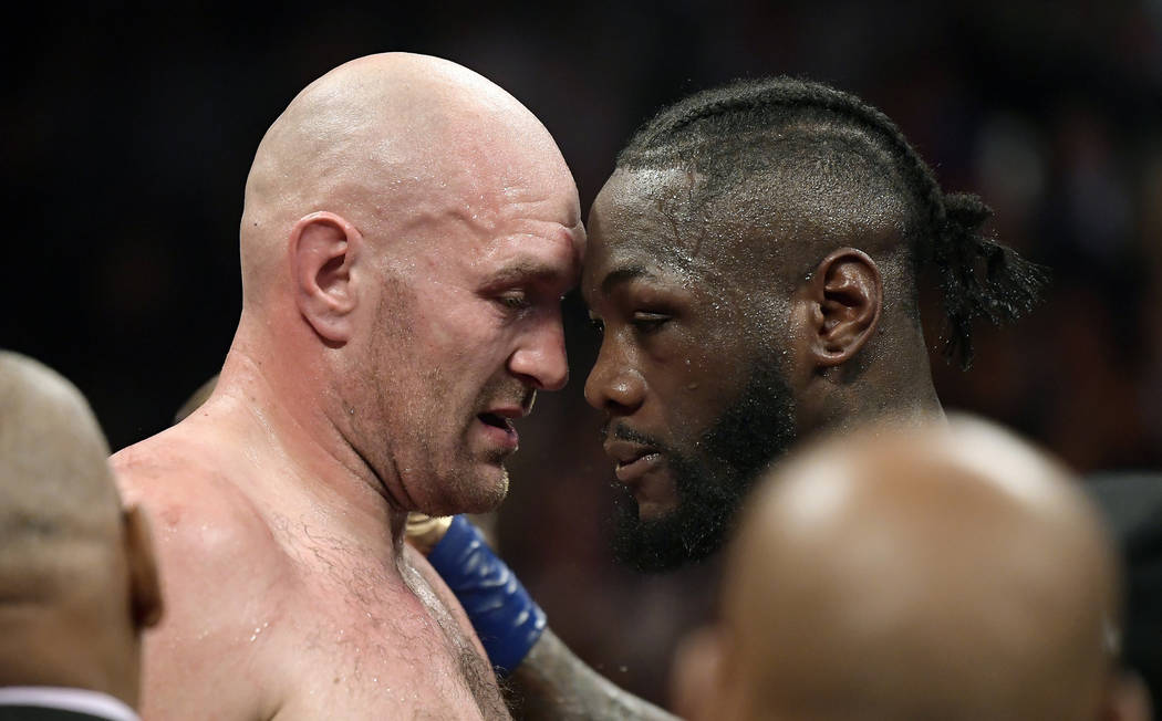 Tyson Fury, left, of England, and Deontay Wilder embrace after their WBC heavyweight championship boxing match, Saturday, Dec. 1, 2018, in Los Angeles. The fight ended in a draw. (AP Photo/Mark J. ...