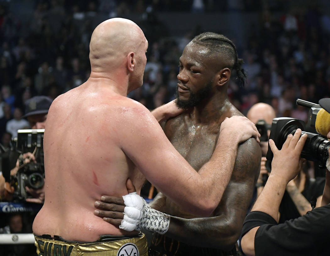 Tyson Fury, left, of England, and Deontay Wilder embrace after their WBC heavyweight championship boxing match, Saturday, Dec. 1, 2018, in Los Angeles. The fight ended in a draw. (AP Photo/Mark J. ...