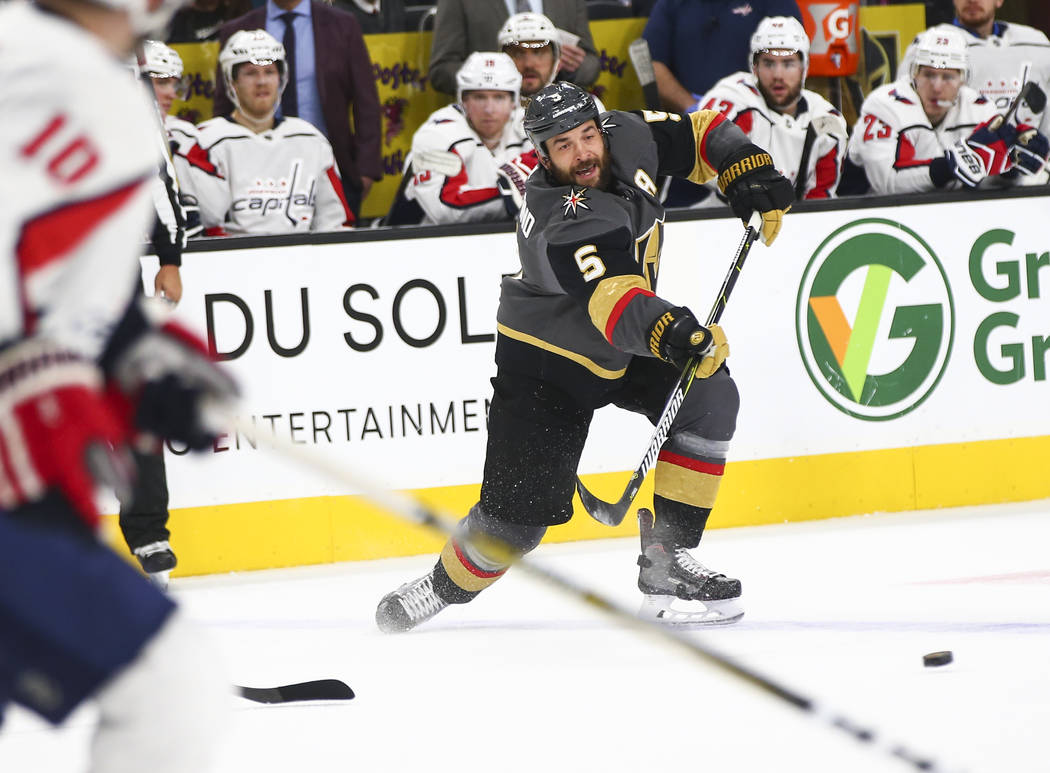 Golden Knights defenseman Deryk Engelland (5) passes the puck during the first period of an NHL hockey game against the Washington Capitals at T-Mobile Arena in Las Vegas on Tuesday, Dec. 4, 2018. ...
