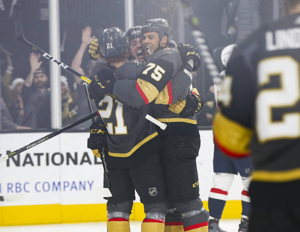 Golden Knights right wing Ryan Reaves (75) celebrates his goal with Cody Eakin, left, and Nate Schmidt during the first period of an NHL hockey game against the Washington Capitals at T-Mobile Are ...