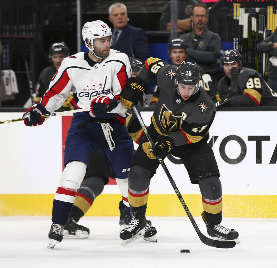 Golden Knights right wing Reilly Smith (19) moves the puck around Washington Capitals right wing Brett Connolly (10) during the second period of an NHL hockey game at T-Mobile Arena in Las Vegas o ...