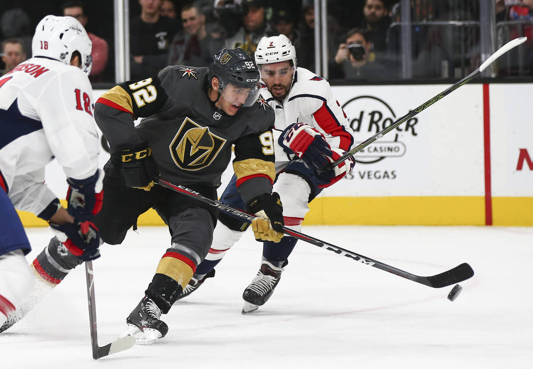 Golden Knights left wing Tomas Nosek (92) moves the puck past Washington Capitals defenseman Matt Niskanen (2) during the second period of an NHL hockey game at T-Mobile Arena in Las Vegas on Tues ...