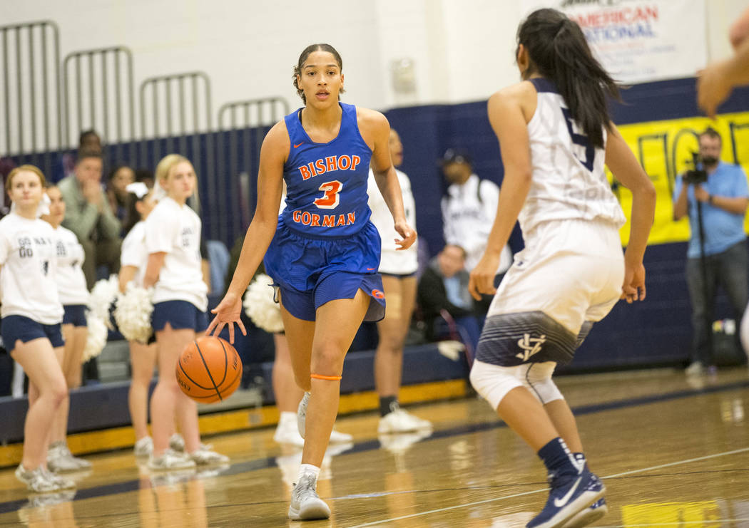 Bishop Gorman's Georgia Ohiaeri (3) dribbles the ball as Spring Valley's Chelsea Camara (5) defends during the first half of a varsity basketball game at Spring Valley High School in Las Vegas on ...