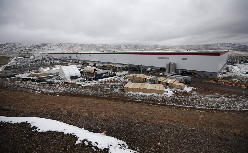 The Tesla Gigafactory, east of Reno, Nev., seen on Tuesday, Dec. 4, 2018, employs more than 7,000 employees. The gigafactory currently sits on a 1.9 million square foot footprint and boosts 5.5 mi ...