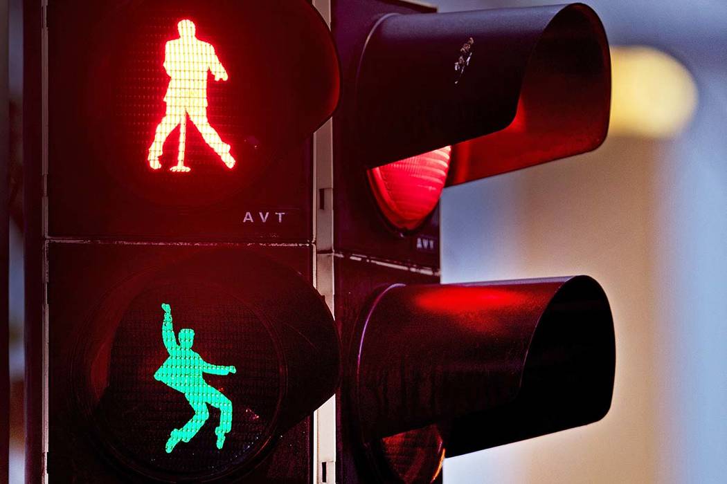 Walking figures depicting Elvis Presley appear on a traffic light switching from green to red in Friedberg near Frankfurt, Germany, Thursday, Dec. 6, 2018. Presley served in Friedberg from October ...