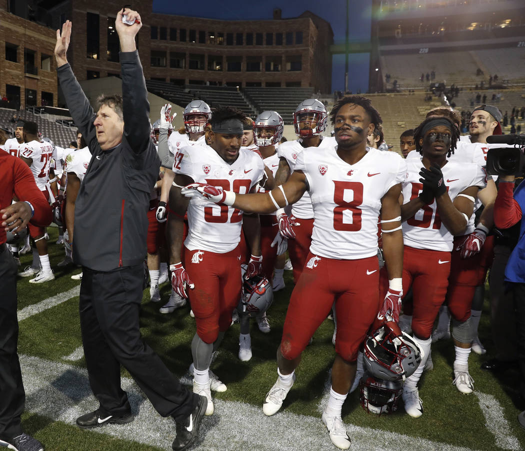 Washington State head coach Mike Leach, front, acknowledges the crowd as his team assembles to sing the school song after an NCAA college football game against Colorado Saturday, Nov. 10, 2018, in … | Washington State head coach Mike Leach, front, acknowledges the crowd as his team assembles to sing the school song after an NCAA college football game against Colorado Saturday, Nov. 10, 2018, in … |