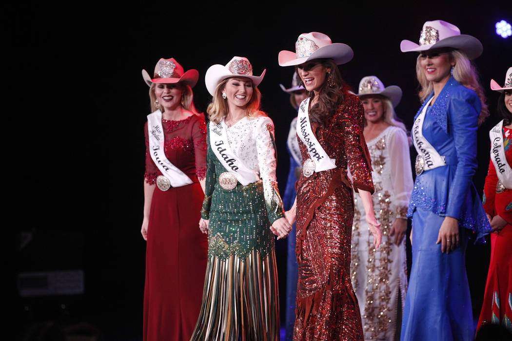 The final five contestants hold hands as they are announced at the Miss Rodeo America 2019 at t ...