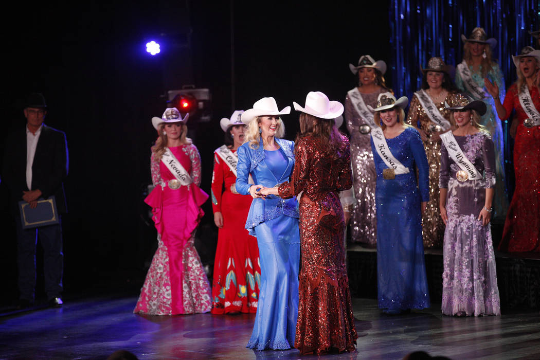 Miss Rodeo Oklahoma Taylor Spears, left, holds hands with Miss Rodeo Mississippi Taylor McNair as they are announced as the last two finalists at the Miss Rodeo America 2019 at the Tropicana hotel ...