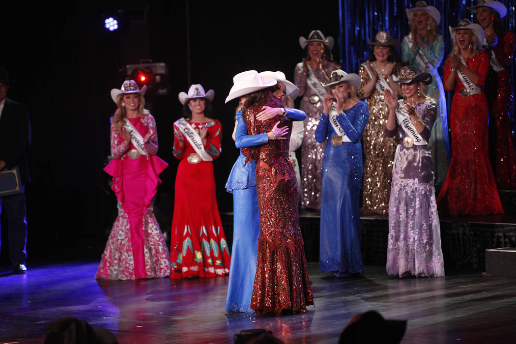 Miss Rodeo Oklahoma Taylor Spears, left, hugs Miss Rodeo Mississippi Taylor McNair as McNair is announced the winner at the Miss Rodeo America 2019 at the Tropicana hotel-casino in Las Vegas, Sund ...