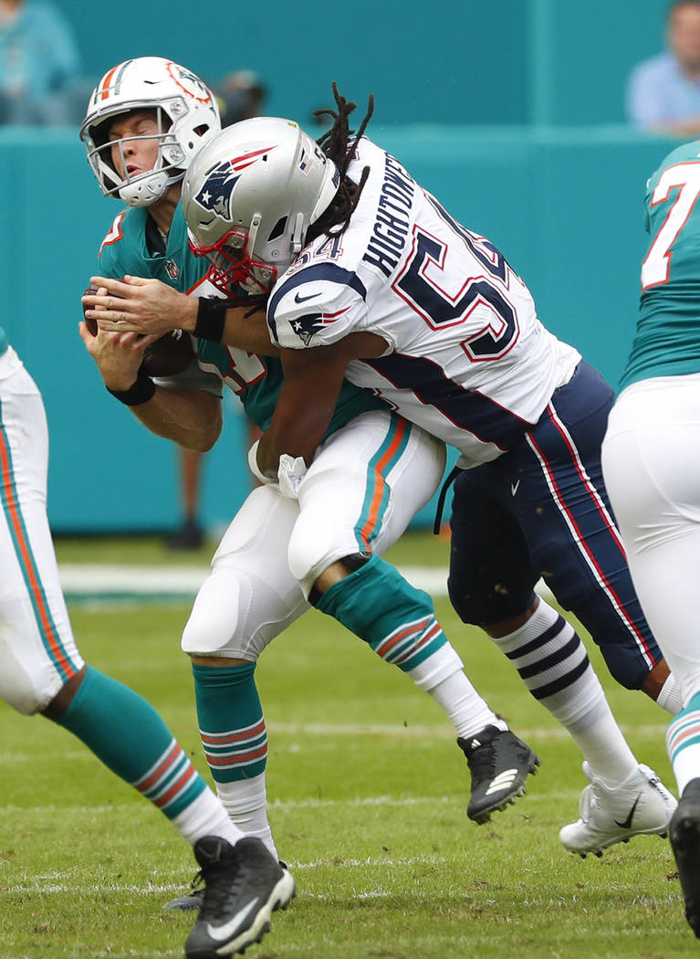 New England Patriots outside linebacker Dont'a Hightower (54) tackles Miami Dolphins quarterback Ryan Tannehill (17), during the first half of an NFL football game, Sunday, Dec. 9, 2018, in Miami ...