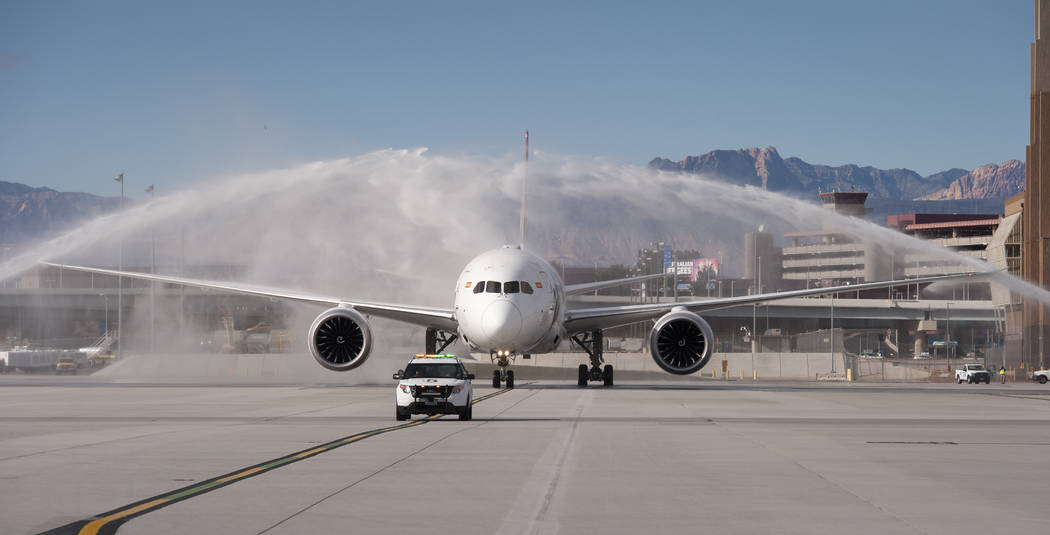 Hainan Airlines flight 7969, a Boeing 787 from Beijing, is greeted with a traditional water arches salute at McCarran International Airport in Las Vegas to inaugurate regular nonstop service from ...