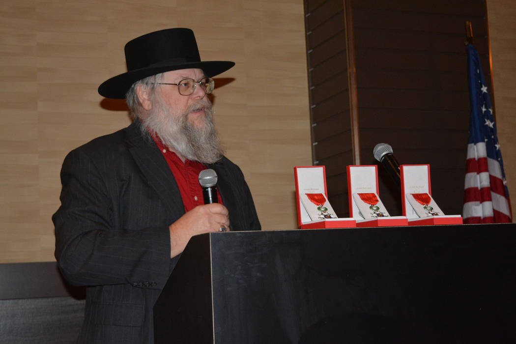 Clark County Museum administrator Mark Hall-Patton speaks Nov. 17 at a presentation honoring three Southern Nevada veterans of World War II. (Bob Reed)