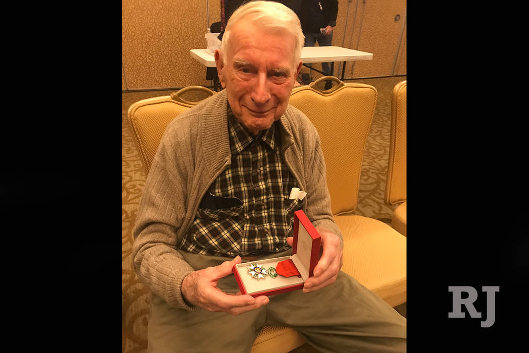 William Kendall, 99, holds his Legion of Honour award at the Anthem Center at Sun City Anthem. (Rachel Spacek/Las Vegas Review-Journal @RachelSpacek)
