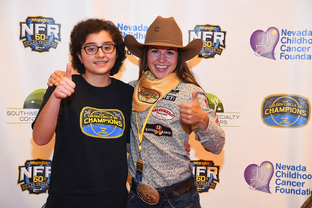 Wrangler NFR barrel racer Hailey Kinsel and her new buddy Aileen Say Sanchez of Las Vegas are all smiles during the Golden Circle of Champions Banquet on Sunday at the South Point. The Golden Circ ...