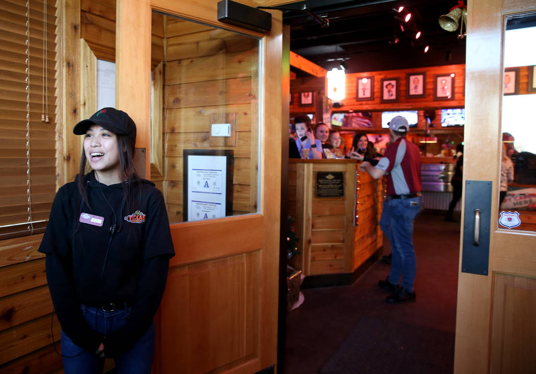 Hostess Nicole Kochensparger welcomes guests to the Texas Roadhouse at 1380 E. Craig Road in North Las Vegas Wednesday, Dec. 12, 2018. K.M. Cannon Las Vegas Review-Journal @KMCannonPhoto