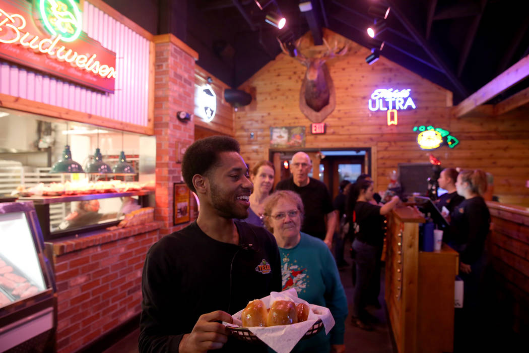 Host Travion King takes guests to their table with fresh baked bread at Texas Roadhouse at 1380 E. Craig Road in North Las Vegas Wednesday, Dec. 12, 2018. K.M. Cannon Las Vegas Review-Journal @KMC ...